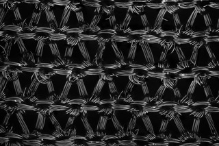 black nylon stockings as seen through a micriscope, looks like a repearting pattern of knots