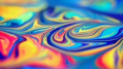 photograph of pink, blue, yellow, and turquoise paint swirls